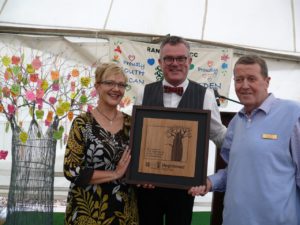 Rayne Stroebel, the Eden Alternative Regional Co-ordinator: South Africa (centre), presents an official Eden plaque to Rae Brown, Rand Aid CEO (right), and Zabeth Zühlsdorff, Rand Aid GM: Services and Advance Division