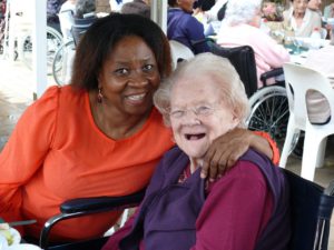 Residents and staff members were in high spirits at the celebration, including Jennifer Sigida and happy resident Noel Tilney